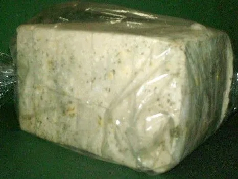 Green and white mold on a block